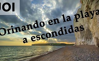 Spanish JOI - Pillados meando escondidos en la playa.